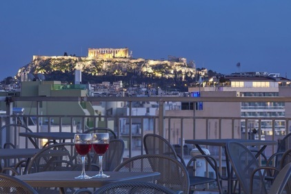Night view of Candia Hotel rooftop with Acropolis view