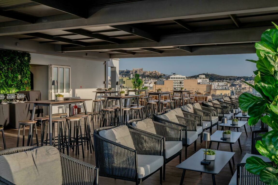 The setup of Candia Hotel Athens rooftop with Acropolis views.