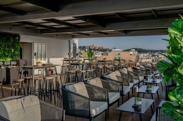 The setup of Candia Hotel Athens rooftop with Acropolis views.